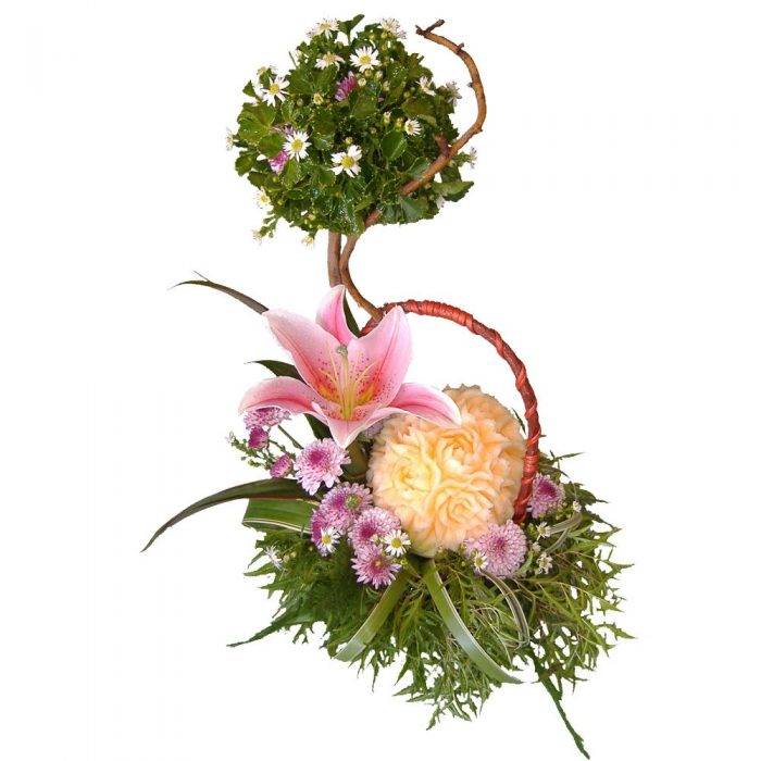 Hand carved melon and Lily in basket of mixed blooms