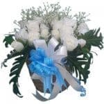 White Roses in a handmade wicker basket