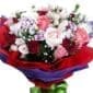 A mix of Roses & Carnations in a bouquet - close up
