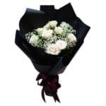 White Roses in a Black Wrap Bouquet