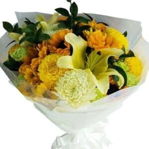 A large bouquet of mixed seasonal blooms of yellow and white